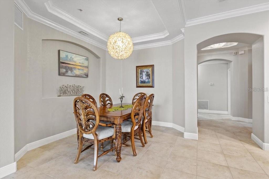 1143 Riverscape Street, Unit A Bradenton, FL 34208 - Photo 6 of 53 a view of a dining room and a table and chairs