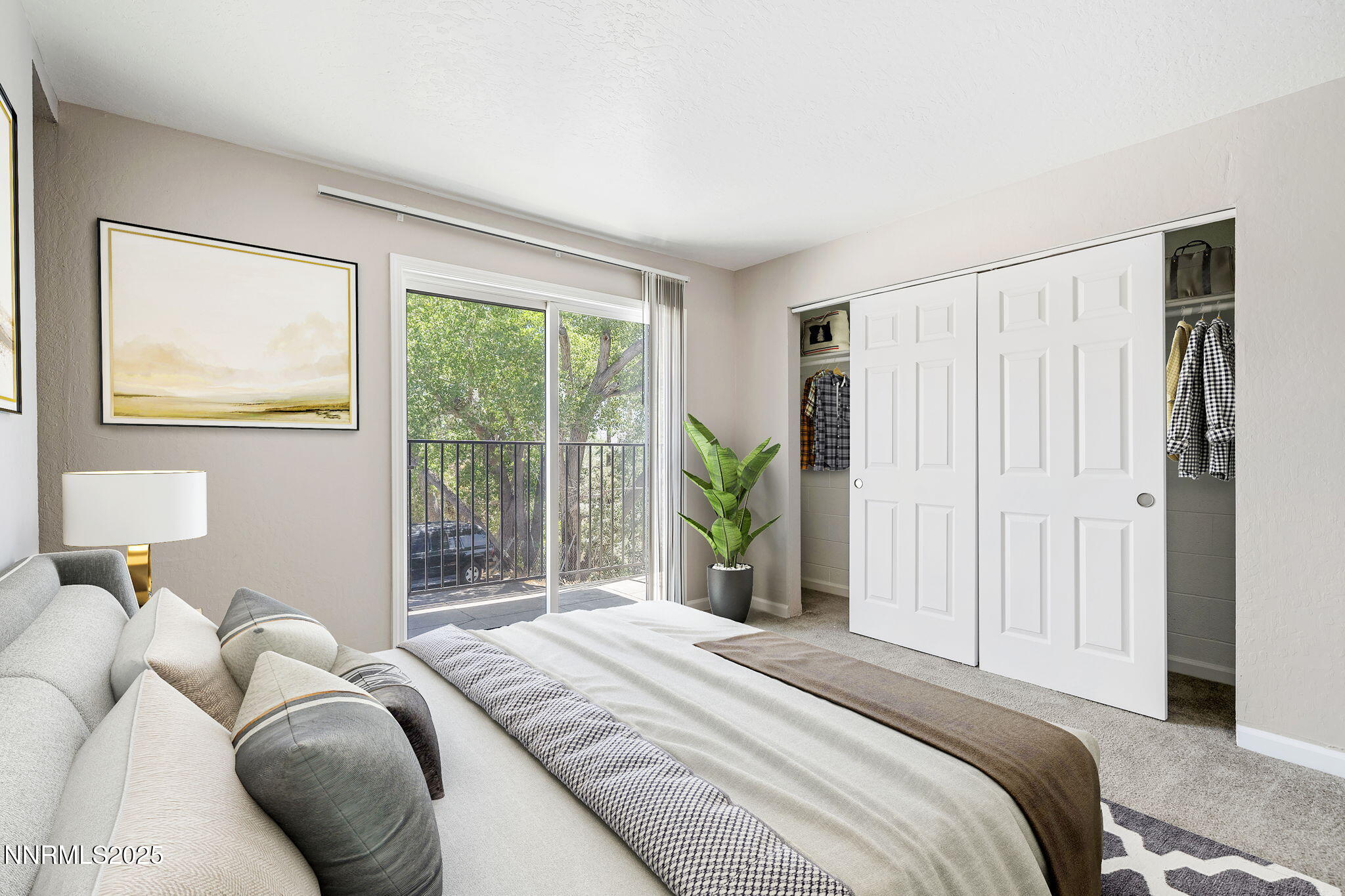 2424 Sutro Street Reno, NV 89512 - Photo 17 of 31 a bedroom with a bed and a large window