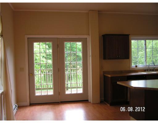 24 Main Street Thomaston, ME 04861 - Photo 2 of 13 Dining Room. doors to deck
