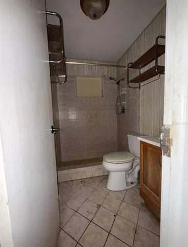 a kitchen with a stove a sink and a refrigerator