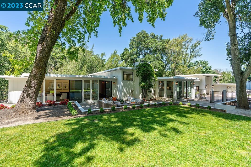 3554 Springhill Road Lafayette, CA 94549 - Photo 1 of 1 front view of a house with a yard patio and swimming pool