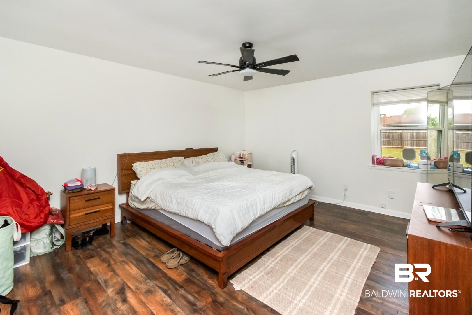 6208 Cottage Hill Road Mobile, AL 36609 - Photo 11 of 20 Bedroom featuring dark wood-style floors and a ceiling fan