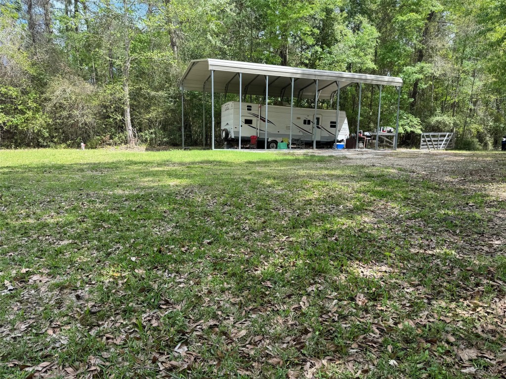 10586 Holland Road Kountze, TX 77625 - Photo 19 of 20 a view of a house with a yard