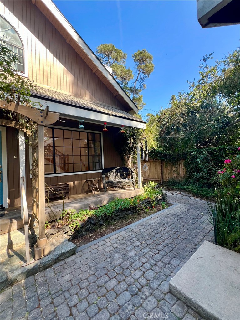 1530 Emerson Road Cambria, CA 93428 - Photo 5 of 54 Front yard walkway wraps around to west side of house towards back yard