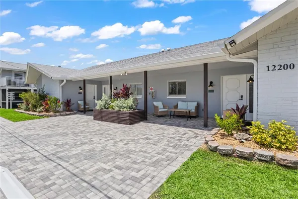 an aerial view of a house with outdoor space
