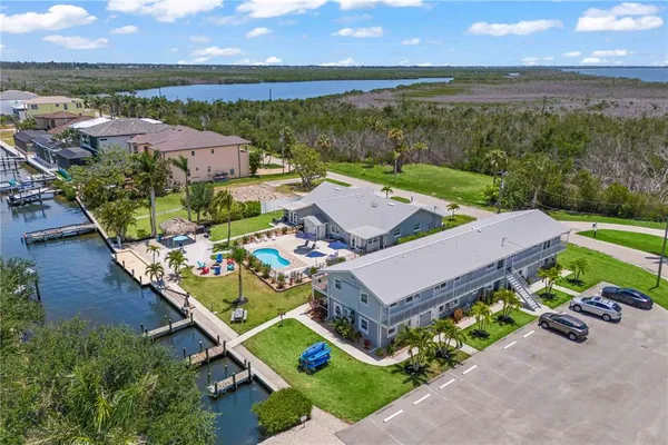 a view of a lake with a table and chairs