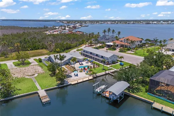 a view of a house with swimming pool and sitting area