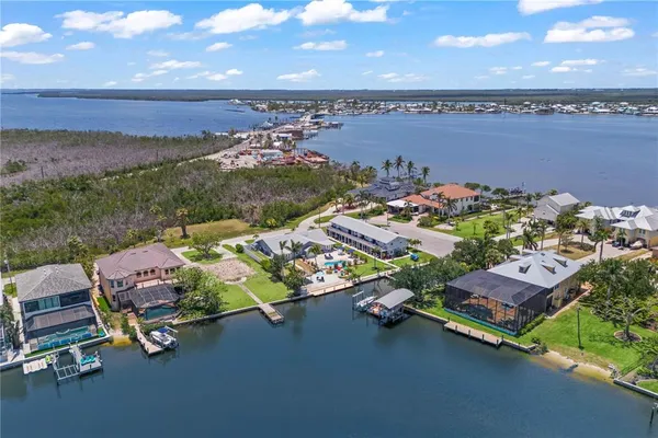 a view of a backyard with sitting area and furniture
