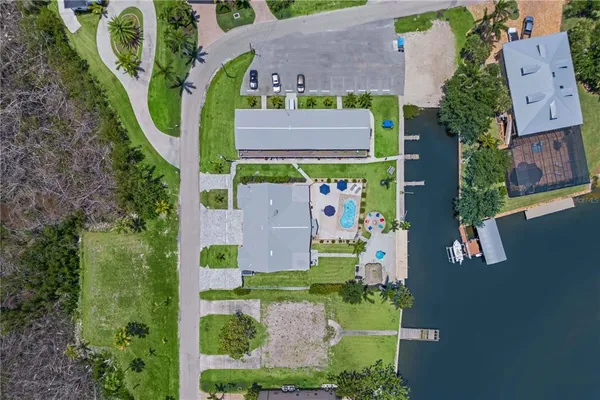 a view of a house with a backyard and a patio