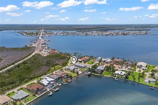 a living room with fireplace furniture and a floor to ceiling window