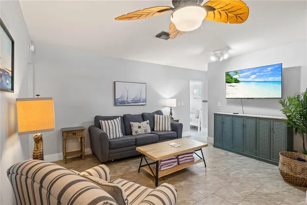 a view of a house with backyard sitting area and garden