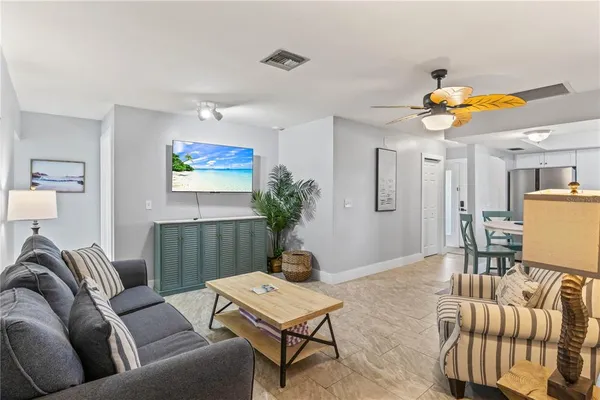 a view of a house with backyard and porch
