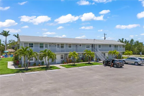 an aerial view of a house with a ocean view
