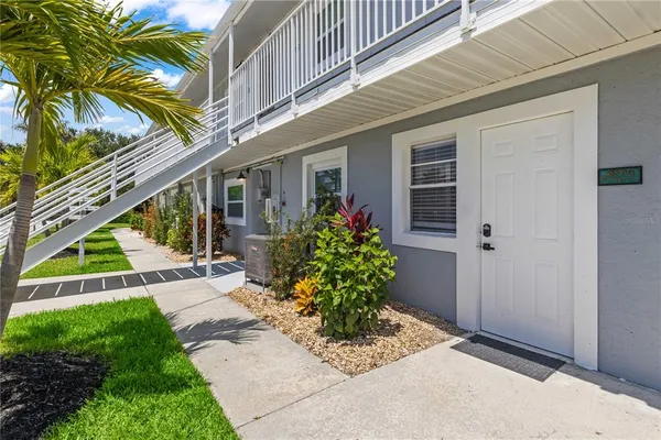 an aerial view of a house with a lake view