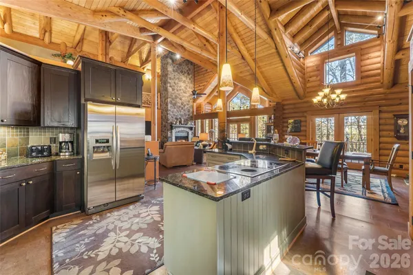 a kitchen with stainless steel appliances granite countertop lots of counter top space