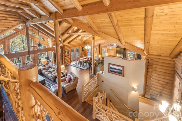 a view of a balcony with wooden floor and fence