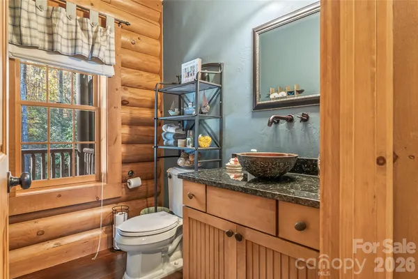 a bed room with furniture and large window