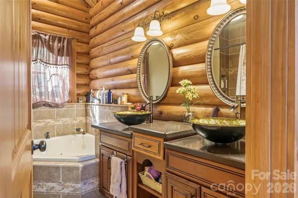 a view of a bathroom with a sink and a mirror