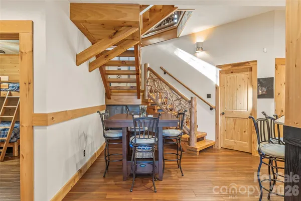 a bedroom with a bed and a flat tv screen on dresser