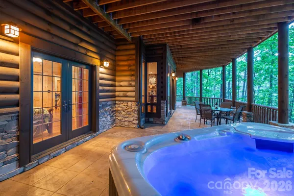 a backyard of a house with table and chairs