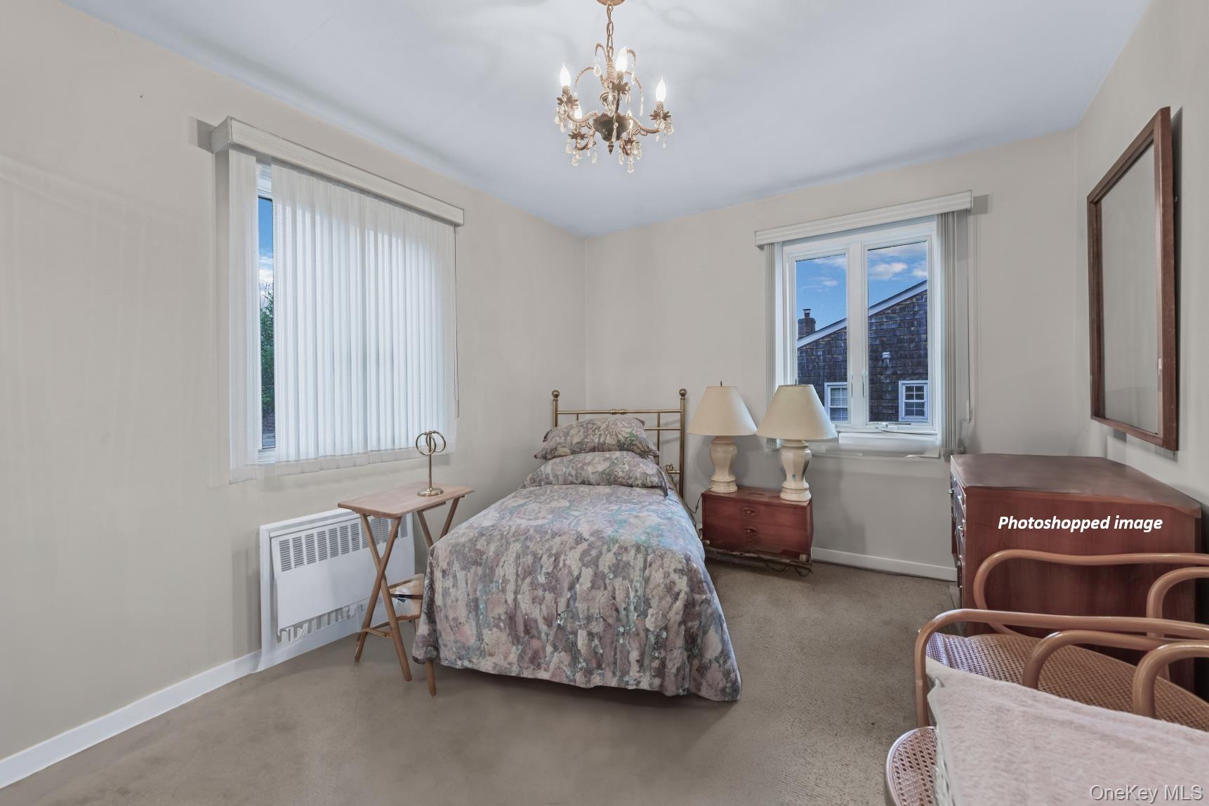 331 Richmond Road Queens, NY 11363 - Photo 11 of 26 a bedroom with bed and window