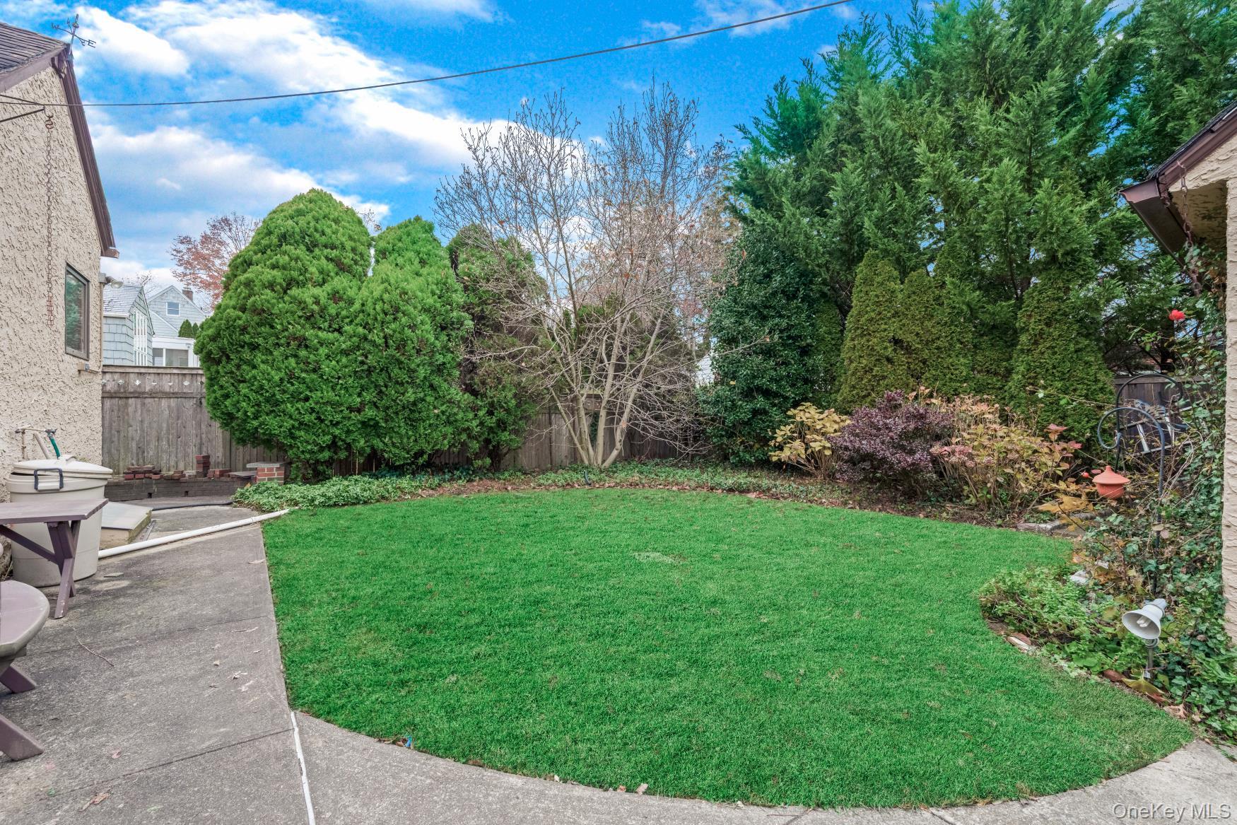331 Richmond Road Queens, NY 11363 - Photo 3 of 26 a view of yard with green space