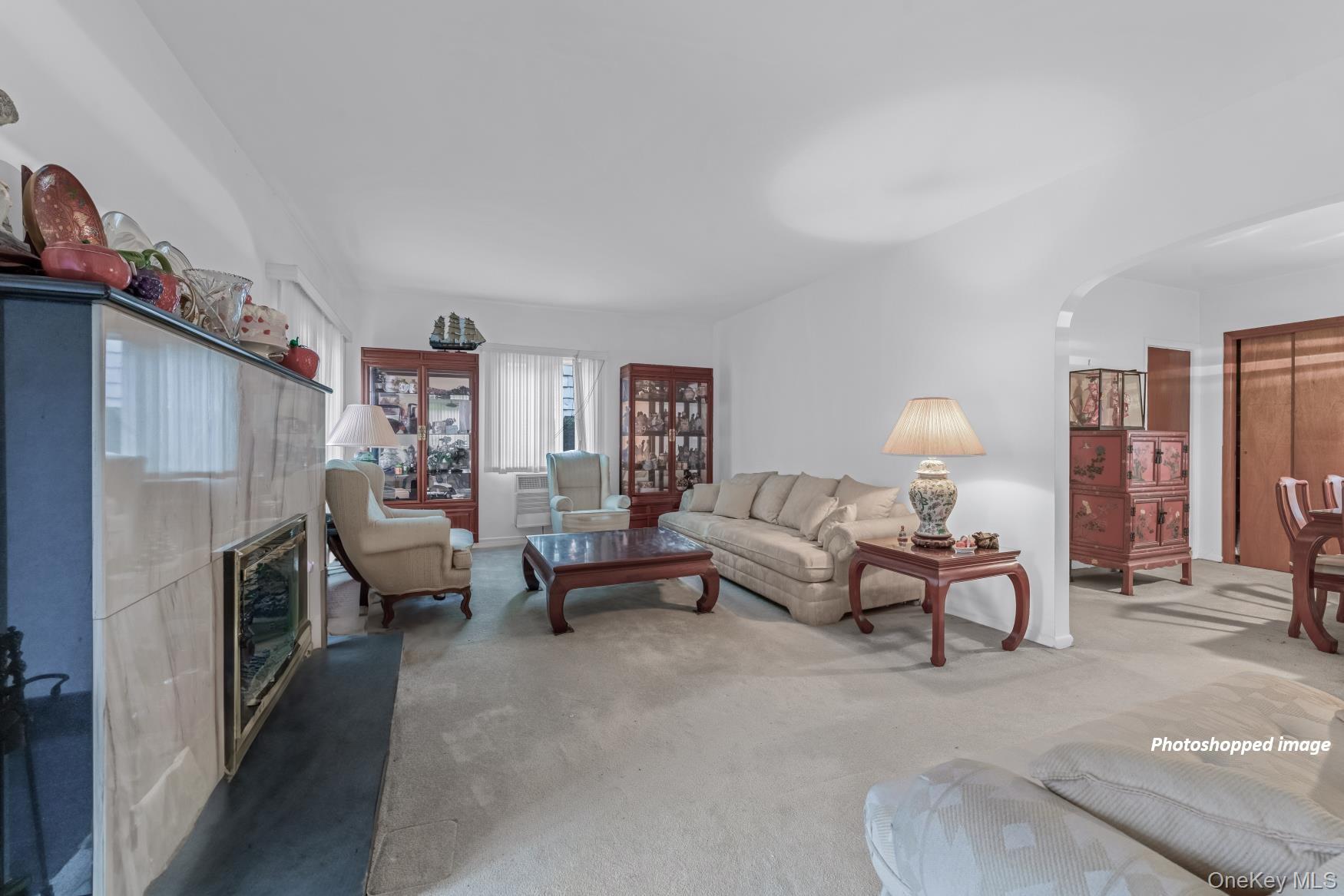 331 Richmond Road Queens, NY 11363 - Photo 6 of 26 a living room with furniture and a fireplace