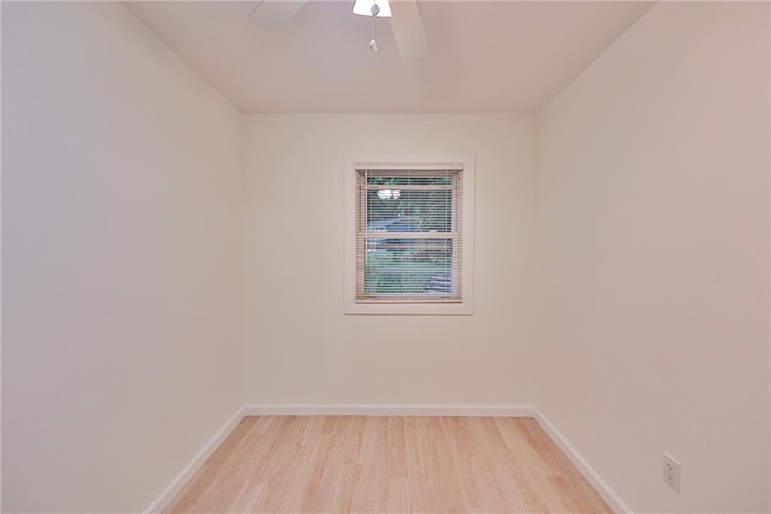5599 Minks Pond Road Bushkill, PA 18324 - Photo 27 of 64 A well-lit room features light wood flooring and a window offering views of natural surroundings.