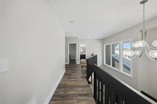 a view of living room with furniture and wooden floor