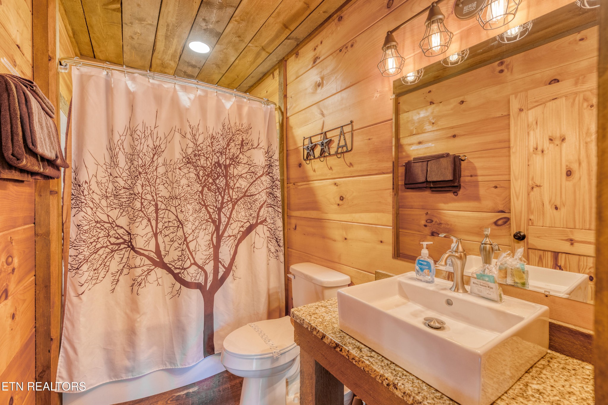 809 Pinecrest Way Sevierville, TN 37862 - Photo 16 of 60 a bathroom with a sink toilet and shower