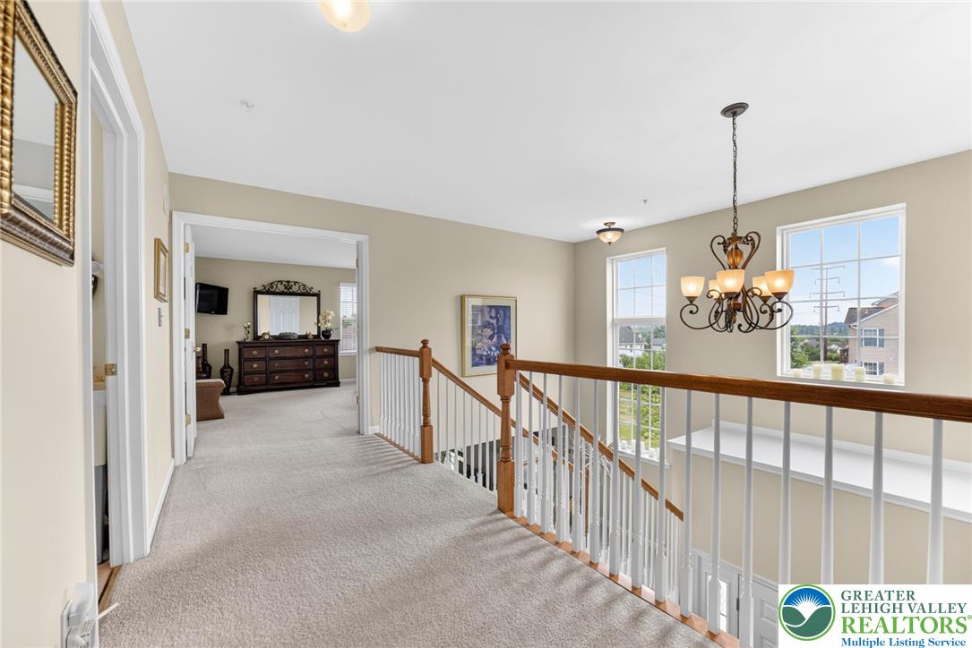 5440 Spring Ridge Drive West Macungie, PA 18062 - Photo 16 of 40 A well-lit landing provides access to bedrooms and overlooks the floor below.