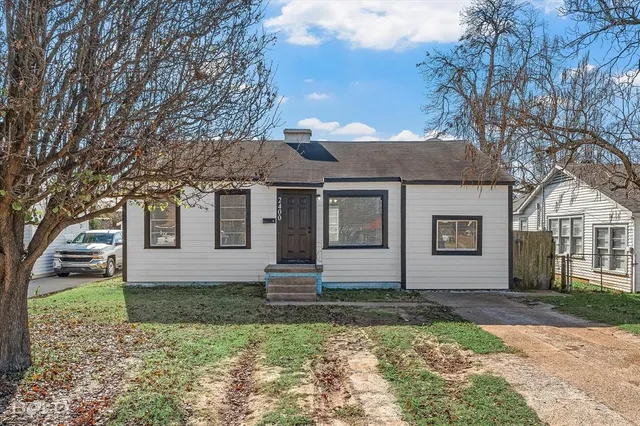 front view of a house with a yard