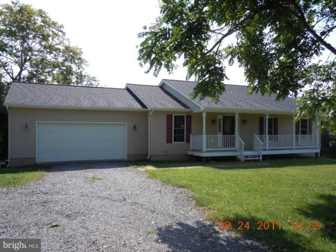 9065 Rixeyville Road Rixeyville, VA 22737 - Photo 12 of 12 a front view of a house with a garden
