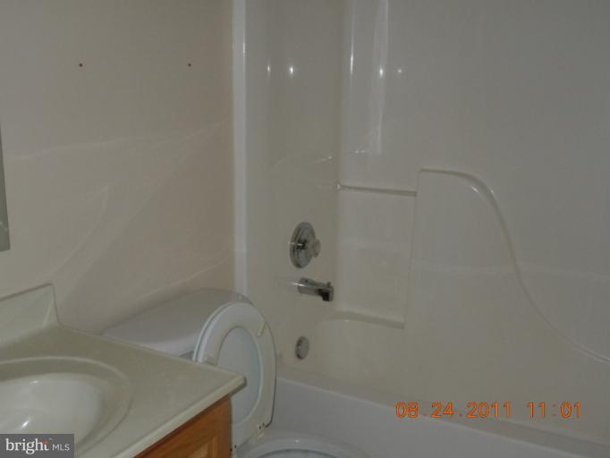 9065 Rixeyville Road Rixeyville, VA 22737 - Photo 5 of 12 a bathroom with a bathtub