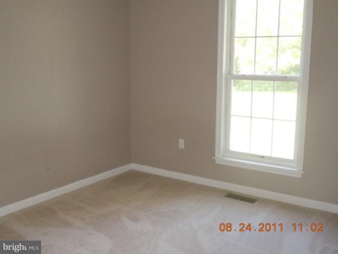 9065 Rixeyville Road Rixeyville, VA 22737 - Photo 6 of 12 an empty room with a window