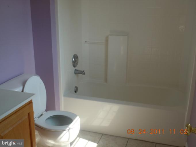 9065 Rixeyville Road Rixeyville, VA 22737 - Photo 8 of 12 a bathroom with a sink a toilet and shower