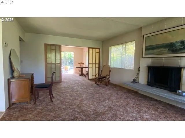 a open kitchen with furniture and a fireplace
