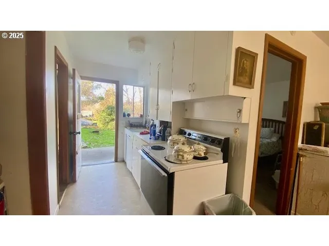 a kitchen with a sink stove and refrigerator