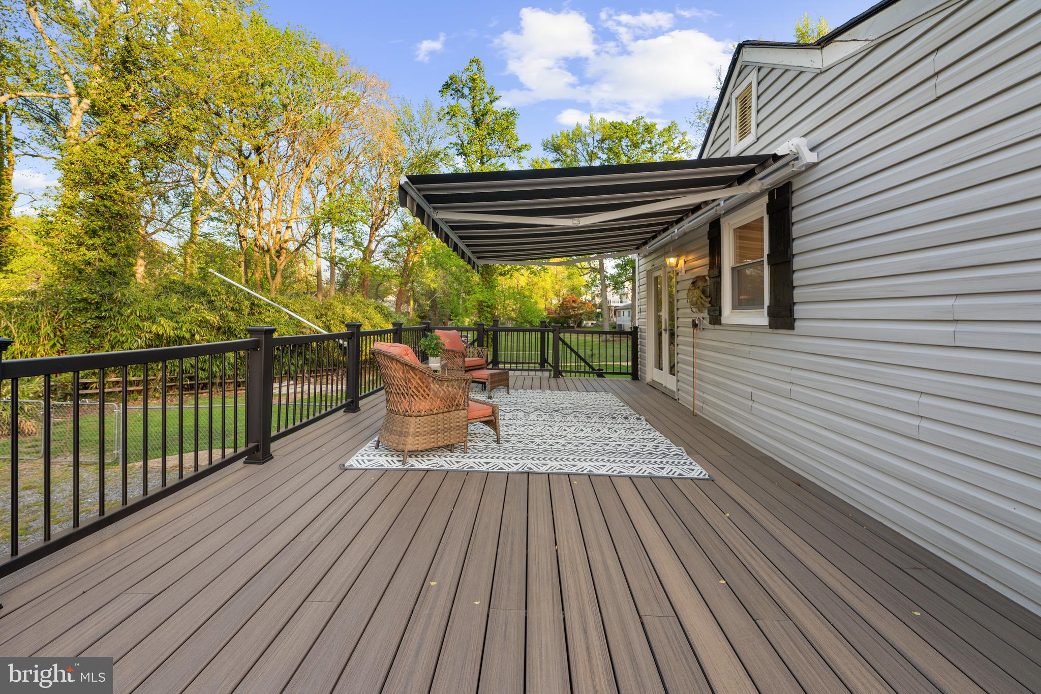 3901 Calawasse Road Edgewater, MD 21037 - Photo 34 of 43 Wraoaround Trex Deck with Retractable Sunshade