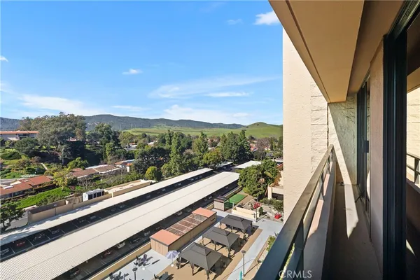 a view of balcony with furniture