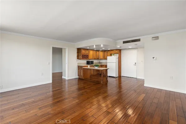 a view of kitchen with cabinets and wooden floor