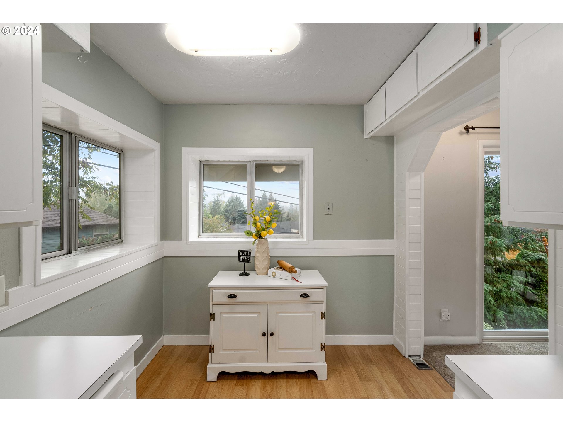 4425 Southwest Dosch Road Portland, OR 97239 - Photo 14 of 40 a bathroom with a sink mirror and window
