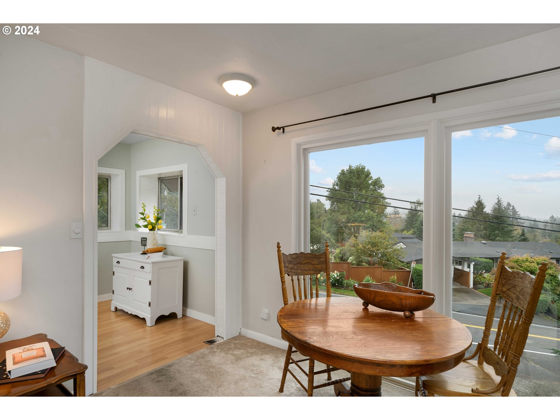 4425 Southwest Dosch Road Portland, OR 97239 - Photo 16 of 40 a workspace with furniture and a potted plant