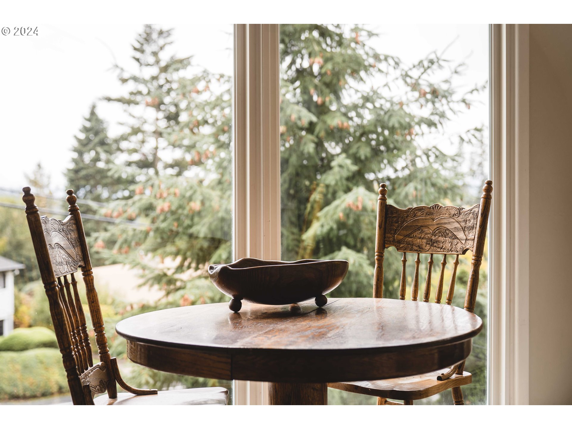 4425 Southwest Dosch Road Portland, OR 97239 - Photo 17 of 40 a view of a dining room with furniture and wooden floor