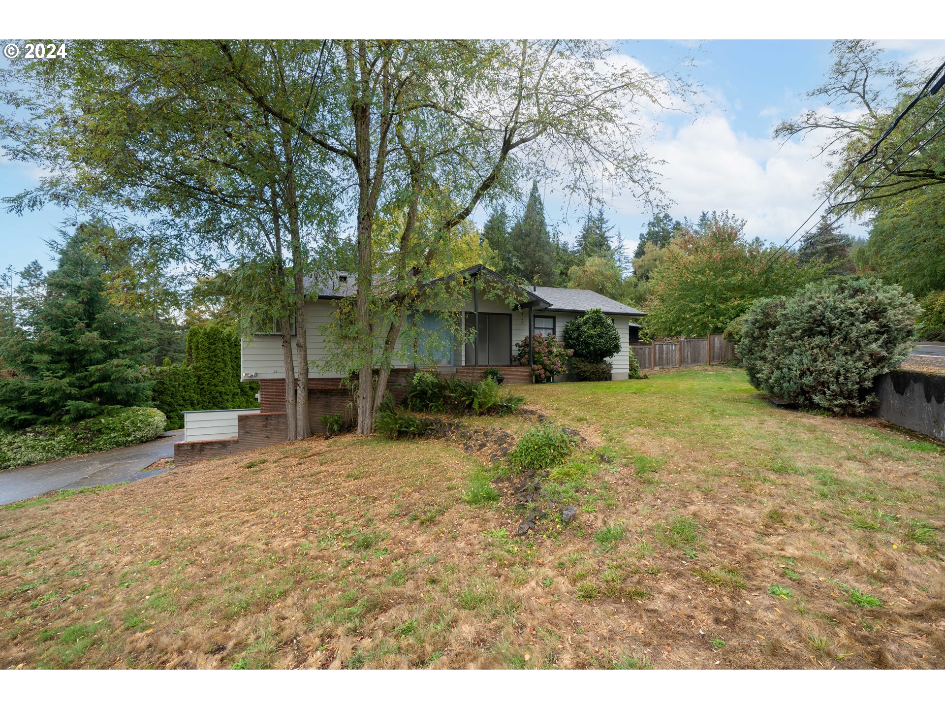 4425 Southwest Dosch Road Portland, OR 97239 - Photo 2 of 40 a view of a house with a yard