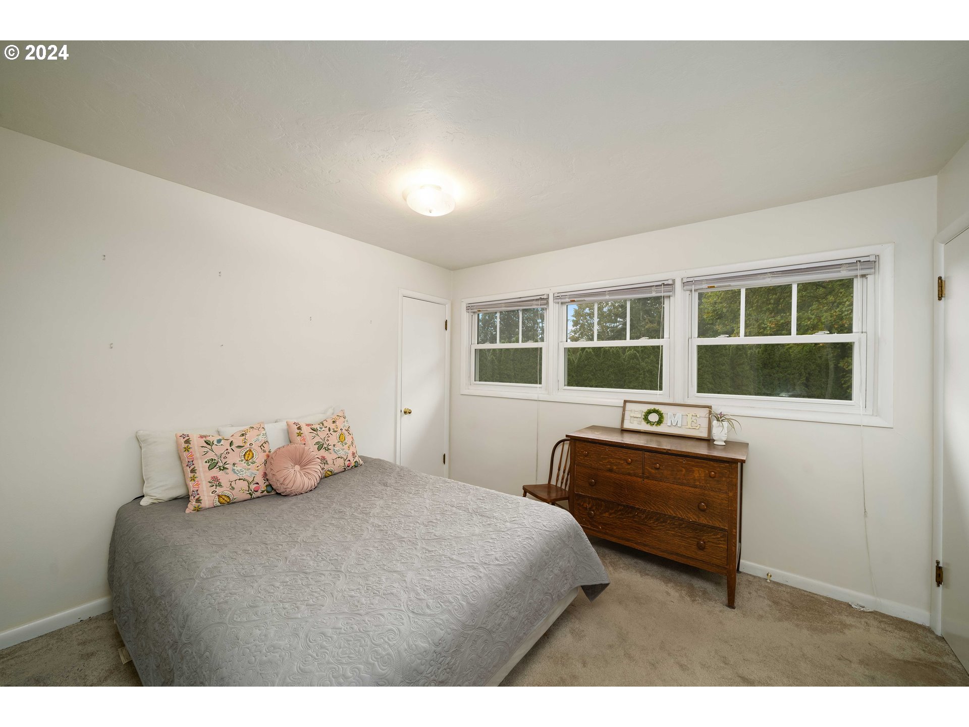 4425 Southwest Dosch Road Portland, OR 97239 - Photo 25 of 40 a bedroom with a bed and window