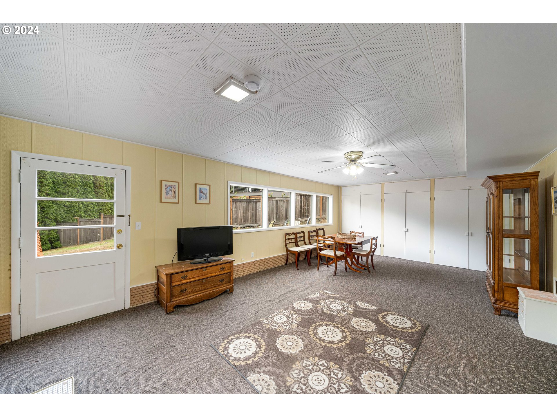 4425 Southwest Dosch Road Portland, OR 97239 - Photo 27 of 40 a living room with furniture and a flat screen tv