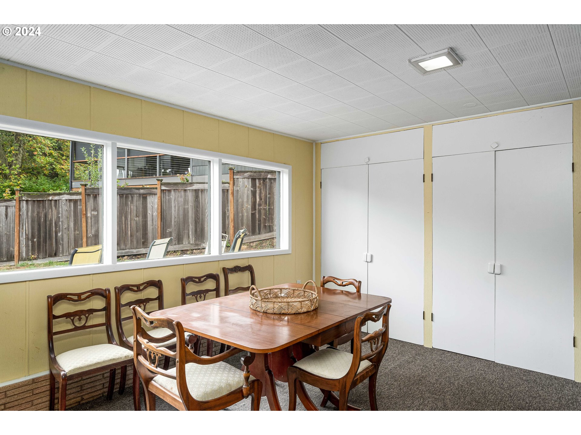4425 Southwest Dosch Road Portland, OR 97239 - Photo 28 of 40 a view of a dining room with furniture window and outside view