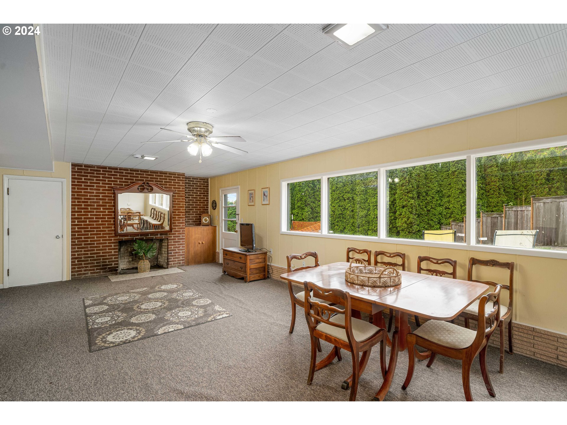 4425 Southwest Dosch Road Portland, OR 97239 - Photo 29 of 40 a view of a dining room with furniture window and outside view