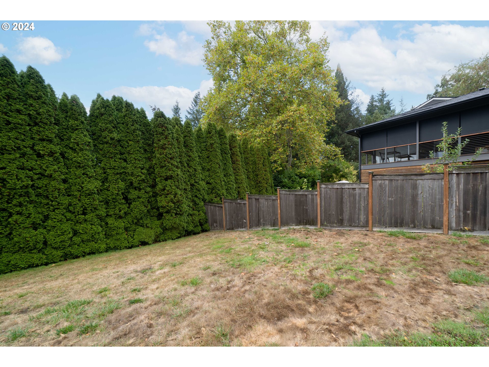 4425 Southwest Dosch Road Portland, OR 97239 - Photo 36 of 40 a view of backyard with wooden fence